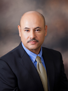 Photo of man in business suit on brown background