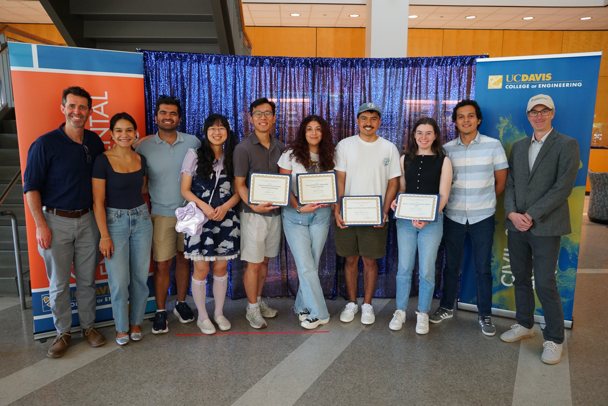 Photograph of students holding awards certificates