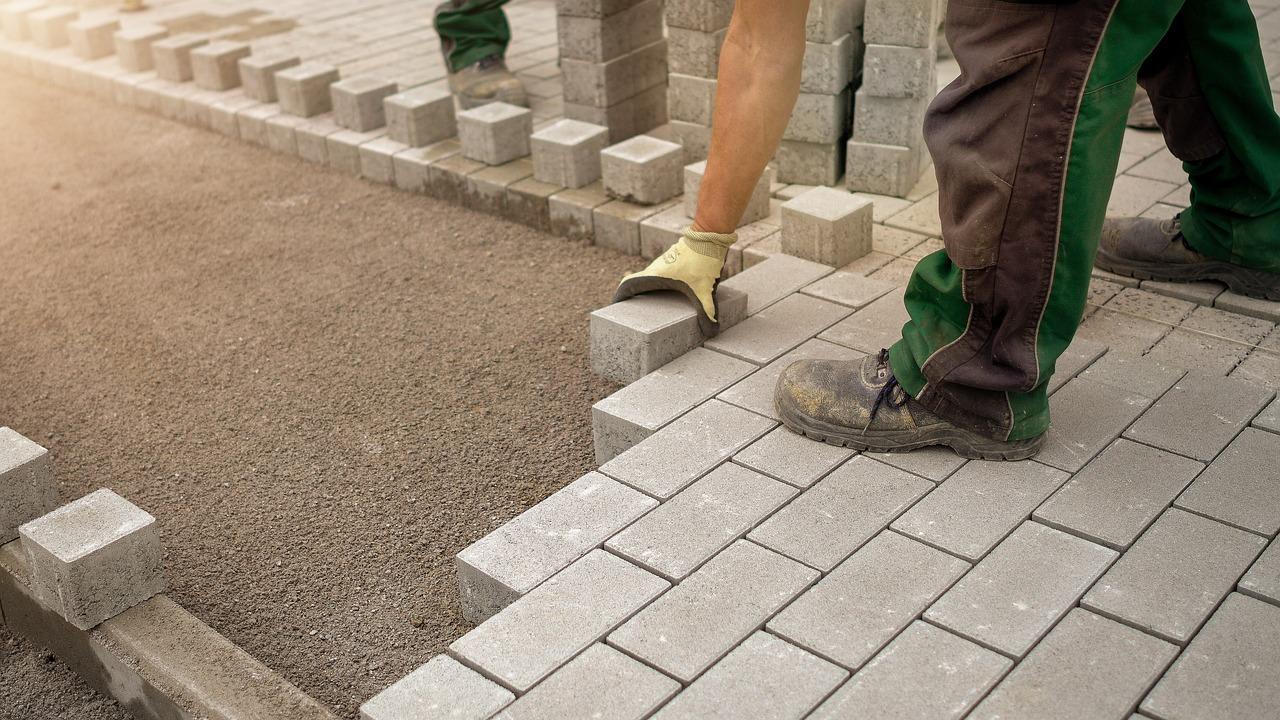 Construction worker paving 