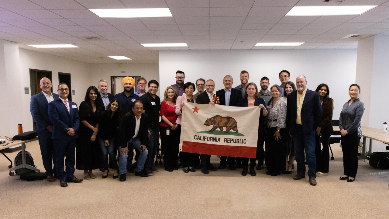 A photo of people holding a California flag