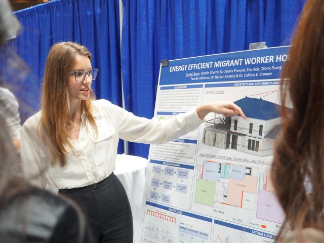 Person Presenting with a posterboard