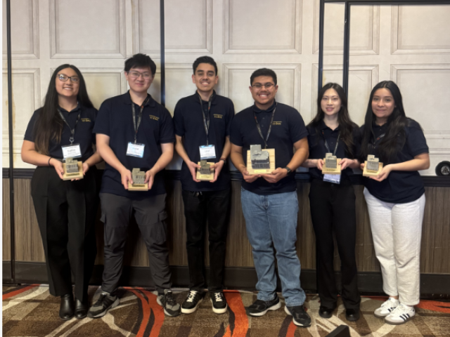 Group of students accepting award
