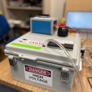 A grey box that says 'TARTA' and 'High Voltage'