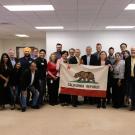 A photo of people holding a California flag